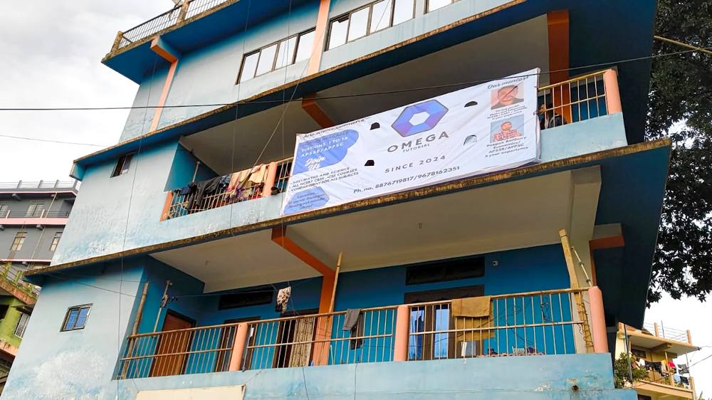 Omega Tutorial signboard on the building at D-Sector, Itanagar